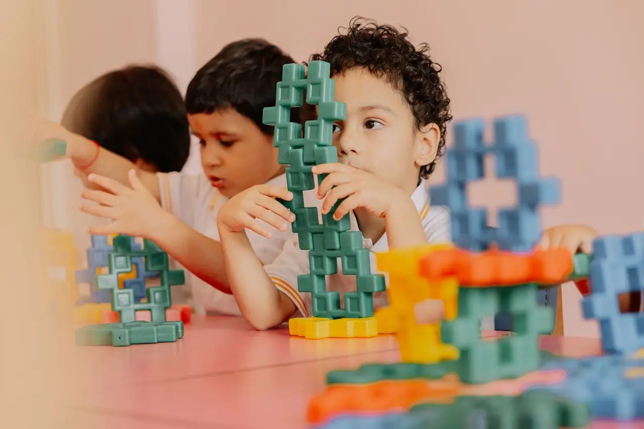 Children building a tower together
