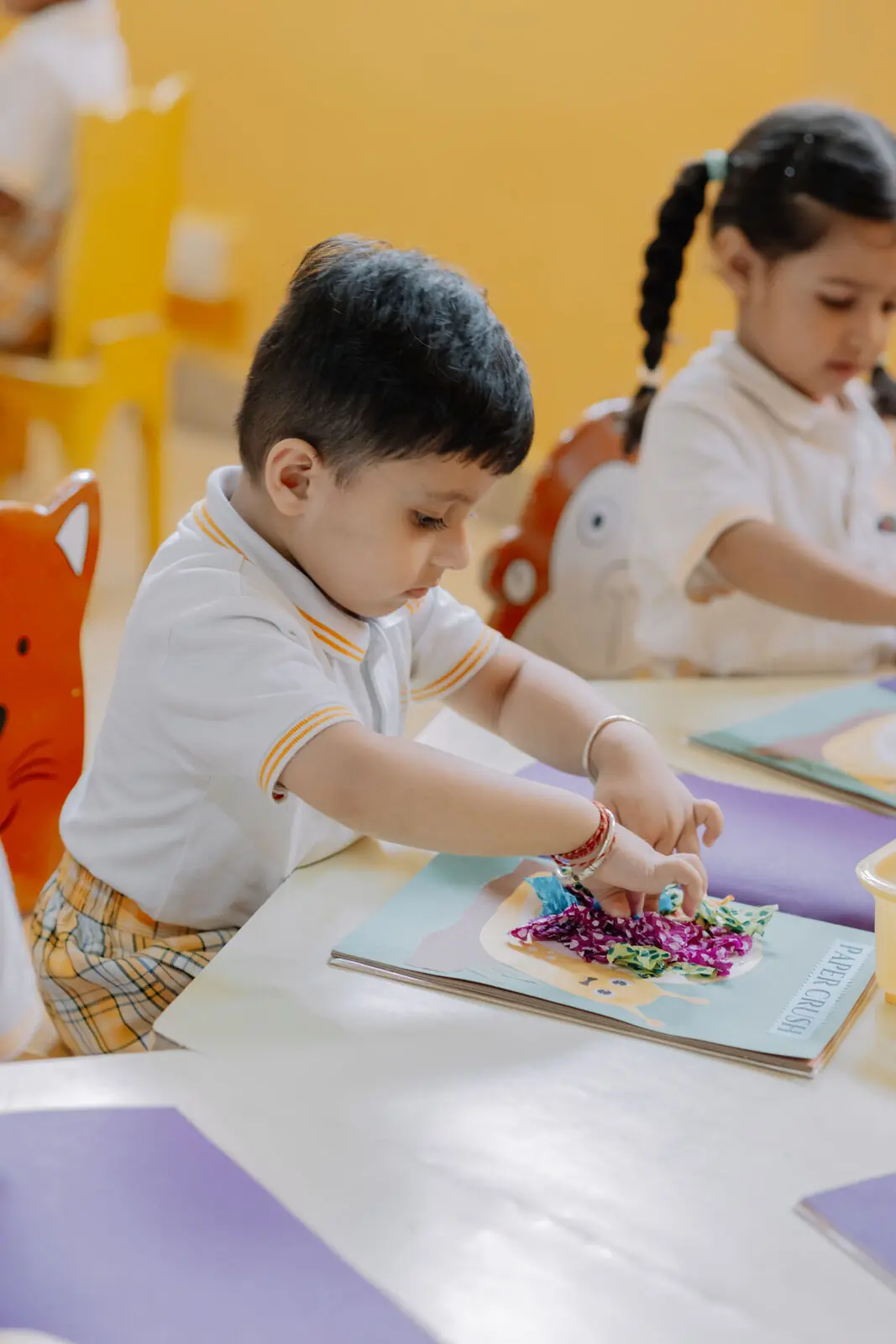 A child working on a craft