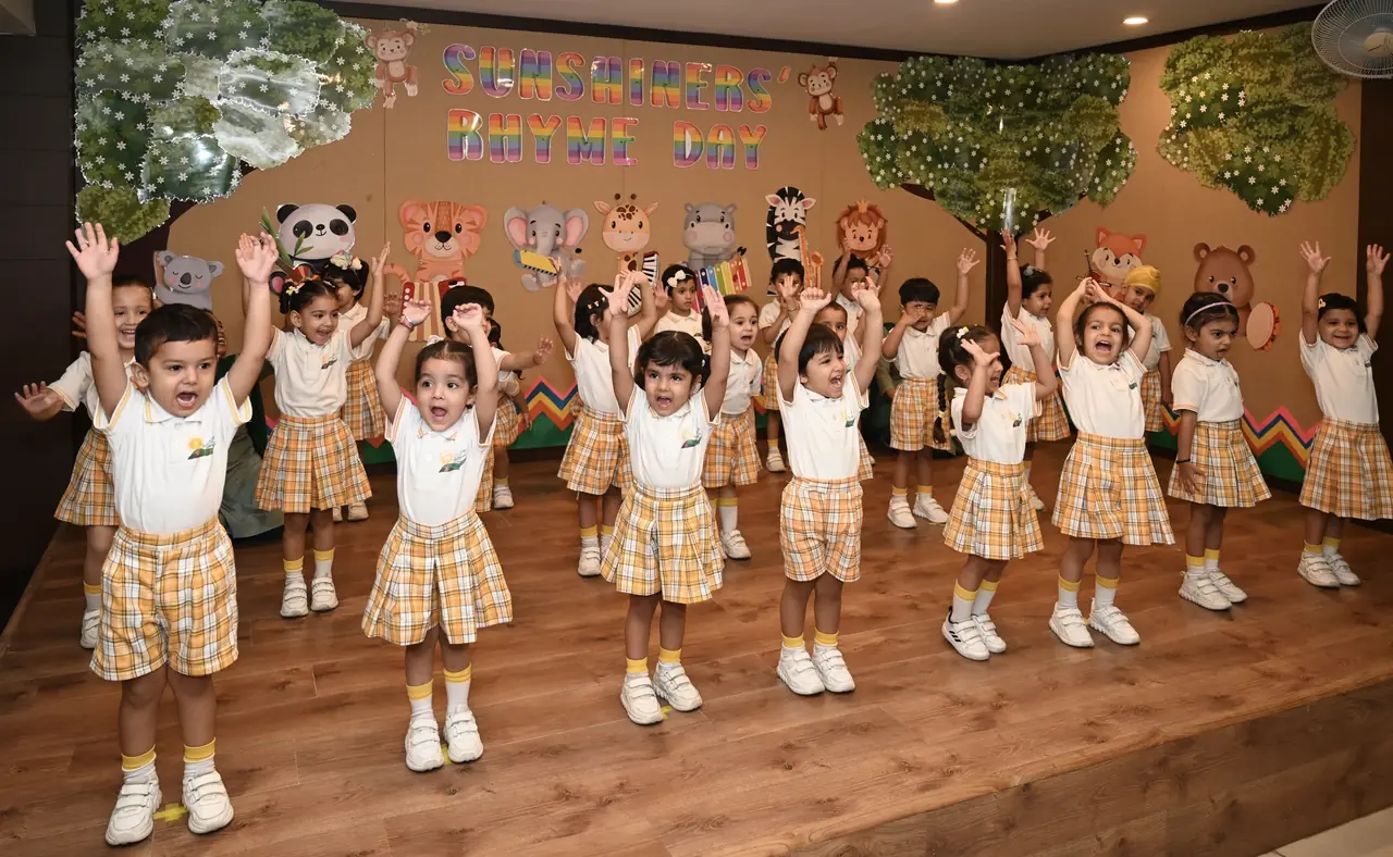 Children singing rhymes on stage