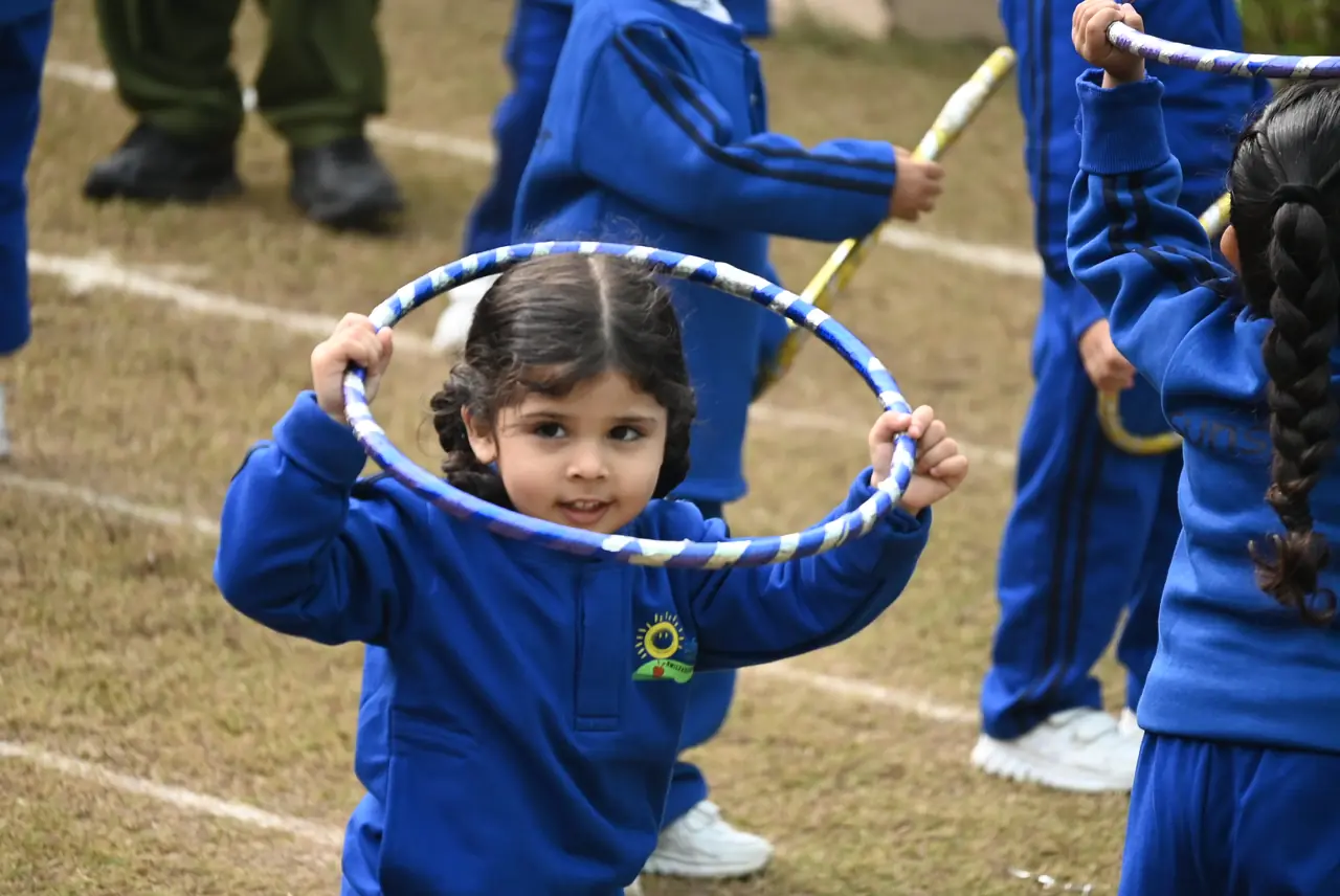 A child with a hoop on Sports Day
