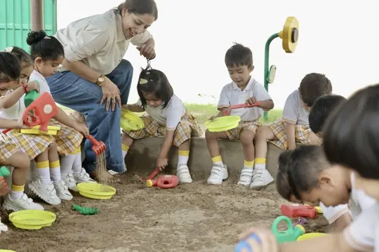 Children playing in the sand pit
