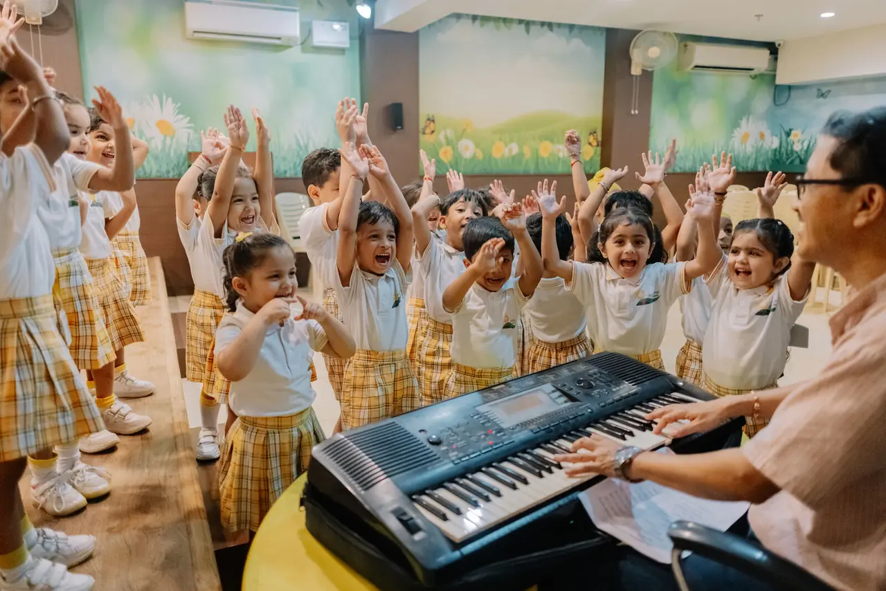 A Rhyme Time session, hands in the air